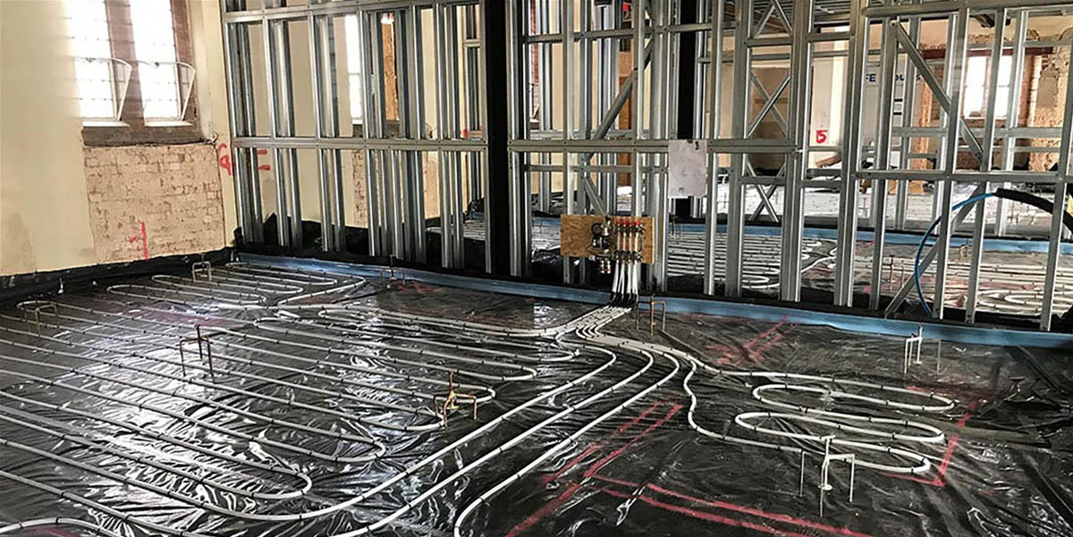 Interior refurbishment work with heated flooring being installed in listed building.